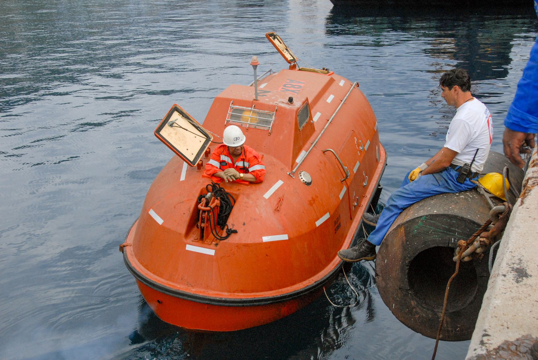 Crew preparing a lifeboat during a safety drill